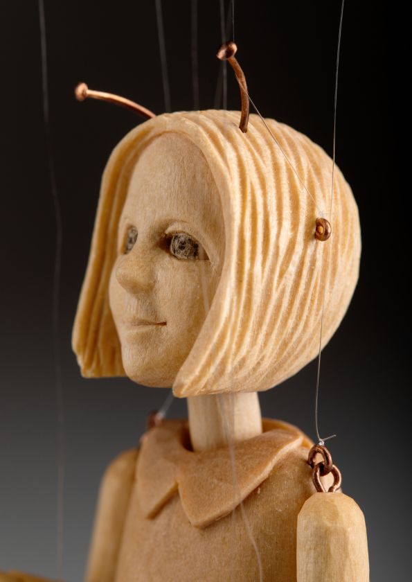 The smallest marionette in the world - a hand-carved wooden