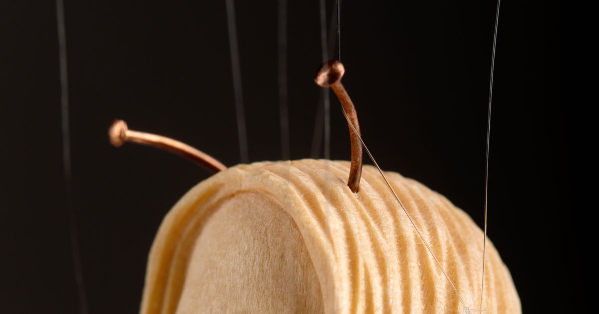 The smallest marionette in the world - a hand-carved wooden